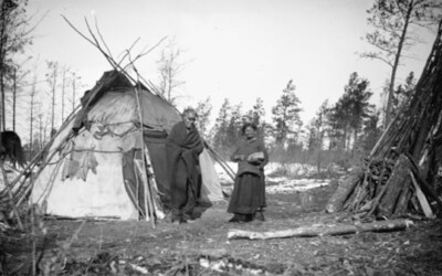 Ho-Chunk Man and Woman near Winter Lodge