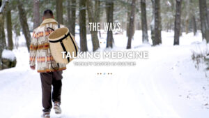 Person walking through snowy forest carrying woven basket, with text “THE WAYS TALKING MEDICINE THERAPY ROOTED IN CULTURE”